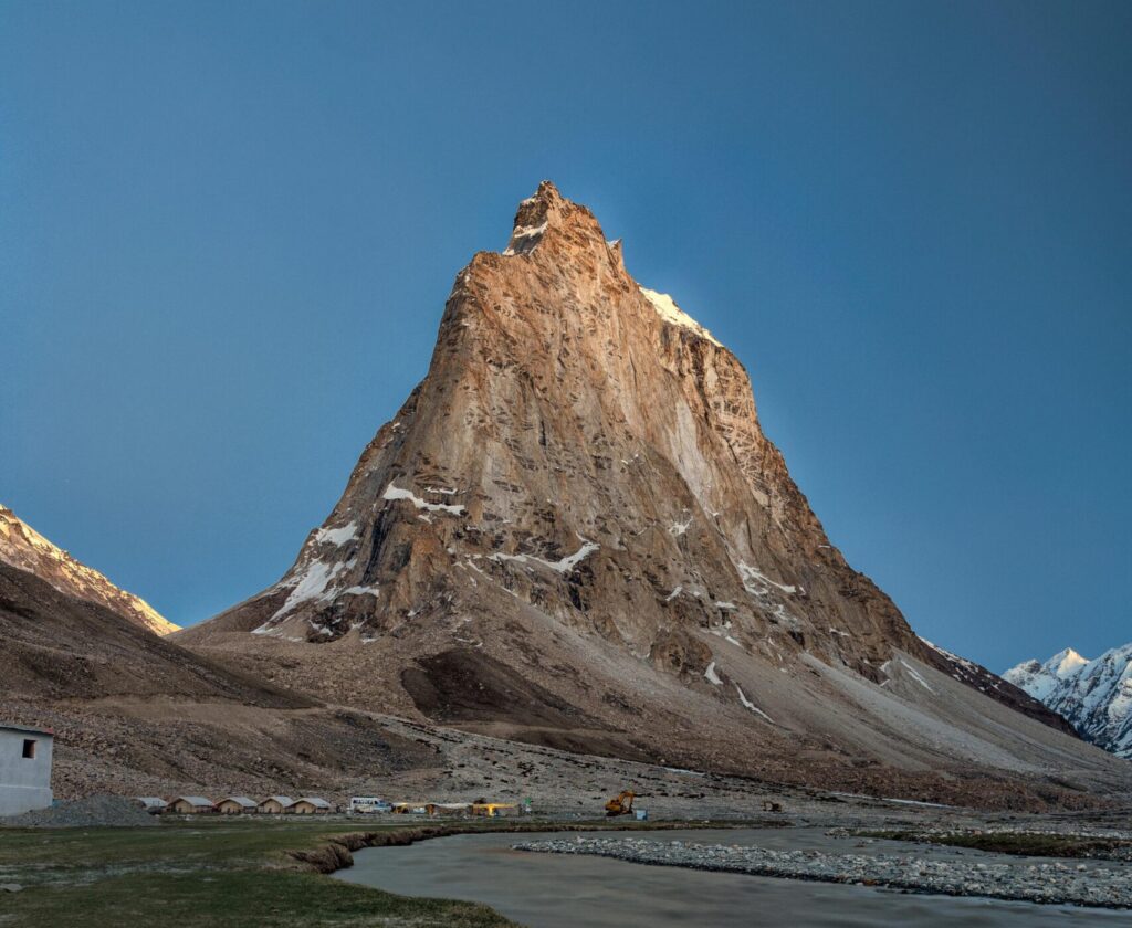 Stunning view of a towering mountain peak in Zanskar Valley, Ladakh, during twilight.