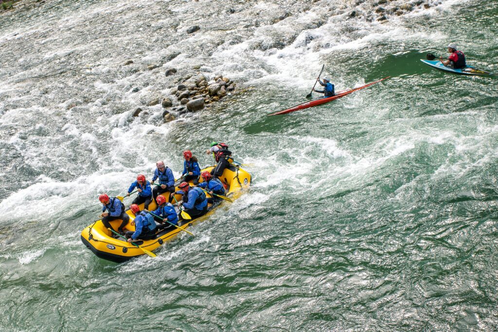 Group enjoying whitewater rafting on a lively river in Ladakh India
